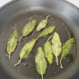 Crisping sage leaves in a skillet with oil